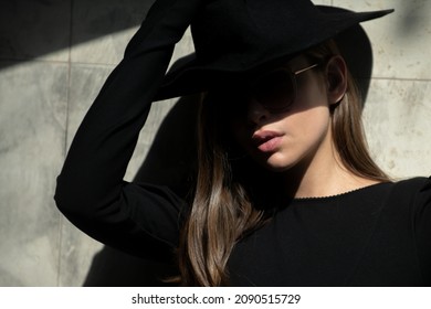 Street Style Photo Of Elegant Fashionable Woman Wearing Trendy Clothes. Model In Hat Walking In Street Of European City. Mafia Woman.