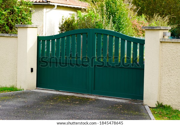 street suburb home dark green metal aluminum\
house gate slats garden access door\
