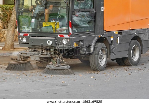 Street sweeper machine working.\
Street cleaning machine.                                           \
