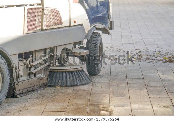 Street sweeper machine working. Street\
cleaning machine.                                 \
