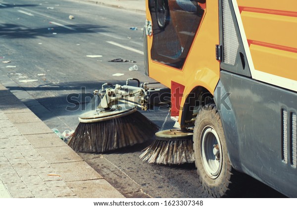 Street sweeper machine working. Street\
cleaning machine.                                    \
