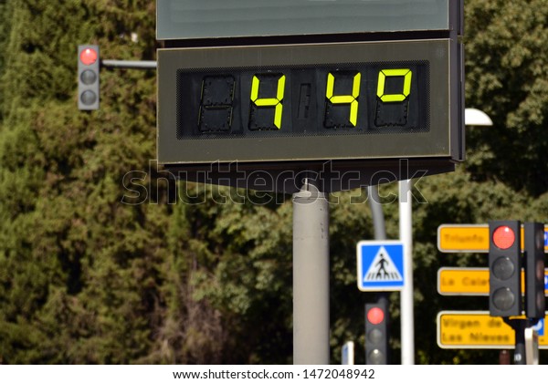 Street\
thermometer on a street marking 44 degrees\
Celsius