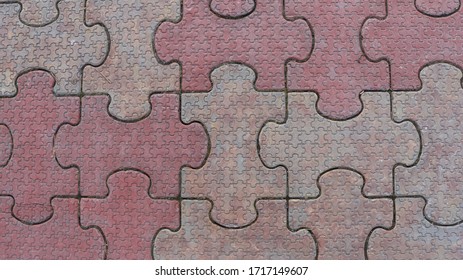 street tiles in the shape of puzzle pieces where a large part consists of small parts - Shutterstock ID 1717149607
