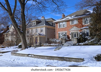 Street Of Traditional Middle Class Single Family Houses On A Sunny Day In Winter