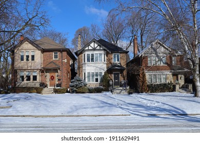 Street of traditional two story brick middle class houses in winter