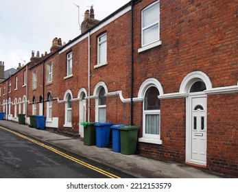 Street Of Typical Brick 19th Century Terraced Houses In Scarborough England With Wheelie Bins On The Pavement