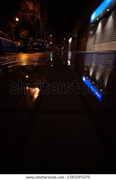 Street Under The Rain\
At Night. Barcelona