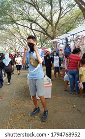 A Street Vendor Fixing His Mask To Obey Health Protocol. Photo Taken On August 10th, 2020 In Sultan Agung Stadium Bantul, Indonesia