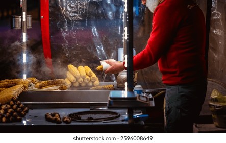 Street vendor in Istanbul selling grilled corn and roasted chestnuts at night, with steam rising, capturing the essence of traditional Turkish street food culture. - Powered by Shutterstock - Get 15% off with code: PIKWIZARD15