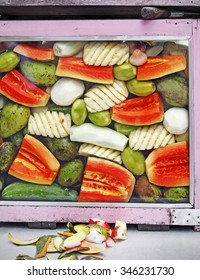 A Street Vendor's Stall Display With Assortment Of Tropical Fruits.
