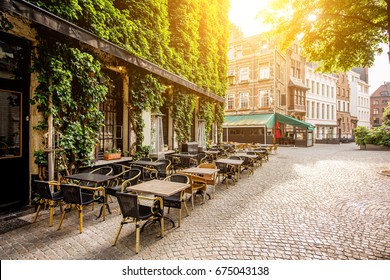 Street view with cafe terrace during the morning in Antwerpen city in Belgium