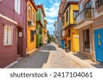 Street view with colorful houses. View of the road between old architectural buildings. Travel view in the historical city. Street perspective formed by several houses in pastel colors. Bursa, Turkey.