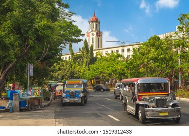 Street View Of Manila With Jeepney And Clock Tower