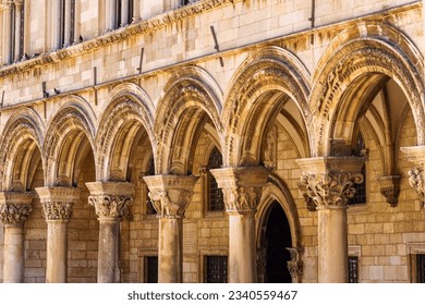 street view of the old town of Dubrovnik in Croatia, arches with columns, architectural details, medieval European architecture, city streets, the concept of traveling in the Balkans - Powered by Shutterstock