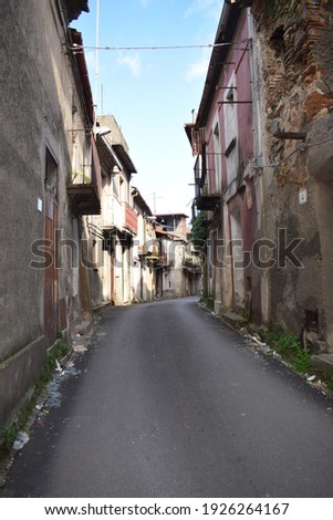 Street view of a small rustic town named Messignadi, in Calabria, Italy