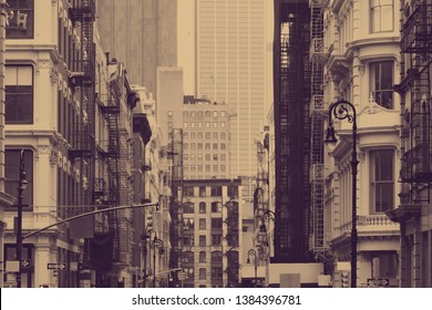 Street view in SoHo New York City with old historic buildings in sepia tone color