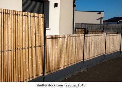 street wall wooden barrier slats around the house fence protection garden access home - Shutterstock ID 2280201543