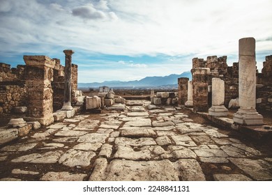 street with white marble pavement among ruins of the ancient city Laodicea in Turkey