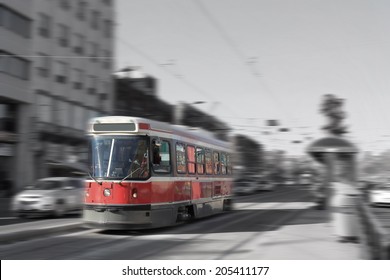 Streetcar Transportation In Downtown Toronto, Canada With Motion Blur In Black And White And Color