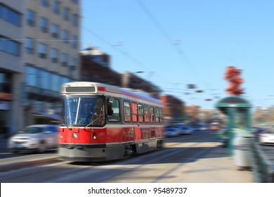 Streetcar Transportation In Downtown Toronto, Canada With Motion Blur