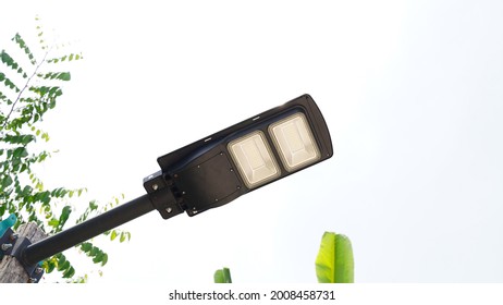 A Streetlight Which Has A Photovoltaic Panel On The Above Side To Get Energy From The Sunlight And Give The Light At Night Installed By The Rural Road In The Northern Part Of Thailand.