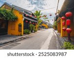 streets with traditional ancient yellow houses and buildings in the old town in Hoi An city in Vietnam