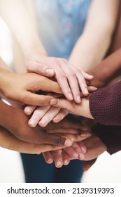 Strength In Numbers. Cropped Shot Of A Group People Putting Their Hands Together In Unity.