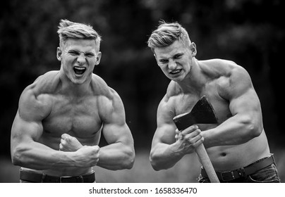 Strength And Perseverance. Handsome Brothers. Strong Men Nature Background. Group Muscular Men With Axe. Athletic Twins Use Ax. Men With Muscular Torso. Genetics Concept. Brotherhood Friendship.