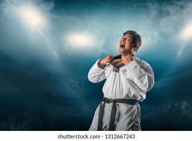 Strength Taekwondo Action Poses In Fire Stadium Background.