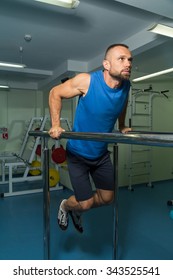 Strength training professional athlete in the gym. Work on tell muscles of the body. Performing difficult exercises to achieve results. Photos for sporting magazines, posters and websites. - Shutterstock ID 343525541