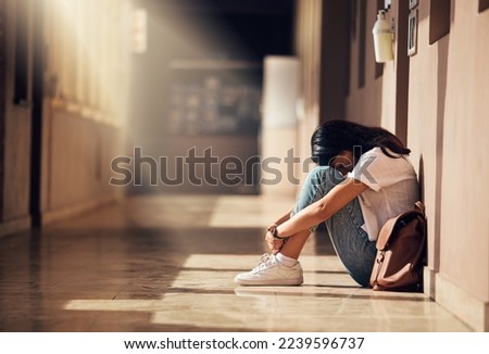Stress, anxiety and depression of university girl with mental breakdown on campus floor. Frustrated, thinking and depressed indian woman suffering and overwhelmed with burnout at college.