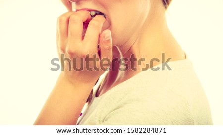 Similar – Crop unrecognizable teenage girl eating healthy walnut kernel