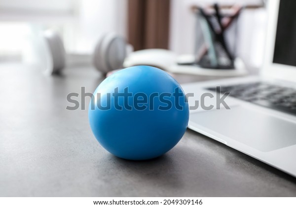 Stress ball on table in\
office