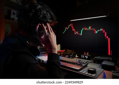 Stress Business man look at the Computer Monitor Screen shows the financial market chart graphic going down. Stock market concept.
red candlesticks going down without resistance, market crash, bear ma