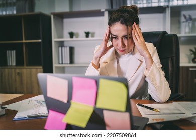 Stress Business Woman Busy And Worried From Overwork. Young Adult Asian Professional Manager Having Office Syndrome At Office. Beautiful Employee Upset In Pain Because Working Too Much Overtime Work.