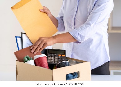 Stress Of Business Woman Packing Brown Cardboard Box Her Belonging After Resign And Signing Cancellation Contract Letter, Change Of Job Unemployment Or Resignation Concept