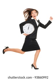Stress - business woman running late with clock under arm. Concept photo with young businesswoman in hurry running against time. Caucasian / Chinese Asian isolated on white background in full length