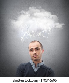 Stress, depression and despair - gloomy storm cloud raining above a businessman head - Shutterstock ID 170846606