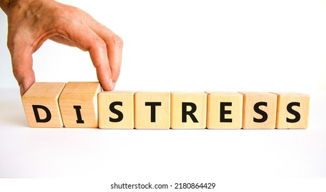 Stress or distress symbol. Psychologist turns cubes and changes the concept word Stress to Distress. Beautiful white table white background, copy space. Psychlogical distress or stress concept.