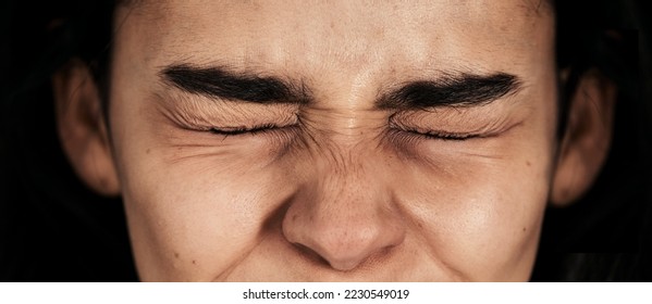 Stress, fear and woman in studio for mental health problem, phobia and anxiety on black background. Eyes, closed and girl in dark room with depression, abuse and psychology, schizophrenia and worry - Shutterstock ID 2230549019