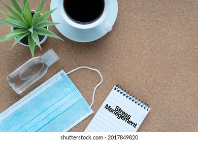 STRESS MANAGEMENT text with face mask, hand sanitizer , coffee cup and  decorative plant on wooden background. Covid-19, Business and copy space concept

 - Powered by Shutterstock