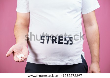 stress, mind problems, bulimia, compulsive overeating, weight gain. overweight man with sedative pills