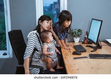 Stress Mother While Working From Home And Babysitting Her Children