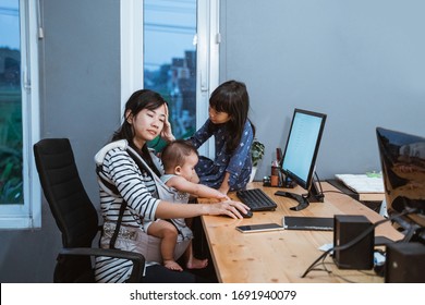 Stress Mother While Working From Home And Babysitting Her Children