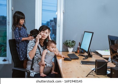 Stress Mother While Working From Home And Babysitting Her Children