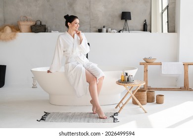 Stress Relief. Rest After Hard Working Day. Young Woman In Spa Bathrobe Taking Shower Bath. Beauty Treatment, Body And Skin Care Concept