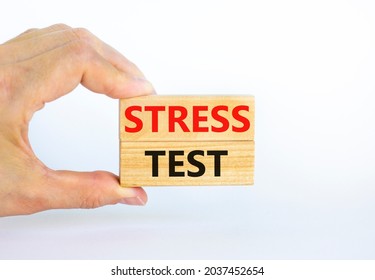 Stress Test Symbol. Concept Words Stress Test On Wooden Blocks On A Beautiful White Background. Businessman Hand. Business And Stress Test Concept, Copy Space.