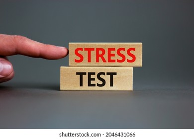 Stress Test Symbol. Concept Words Stress Test On Wooden Blocks On A Beautiful Grey Background. Businessman Hand. Business And Stress Test Concept, Copy Space.