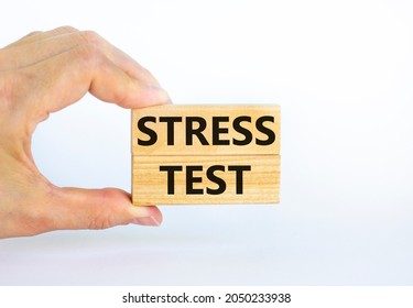 Stress Test Symbol. Concept Words Stress Test On Wooden Blocks On A Beautiful White Background. Businessman Hand. Business And Stress Test Concept, Copy Space.