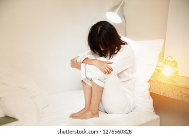 The Stress Woman Sitting On Bed,turn Face Down,unhappy Feeling,sleepless,depressive Disorder Syndrome